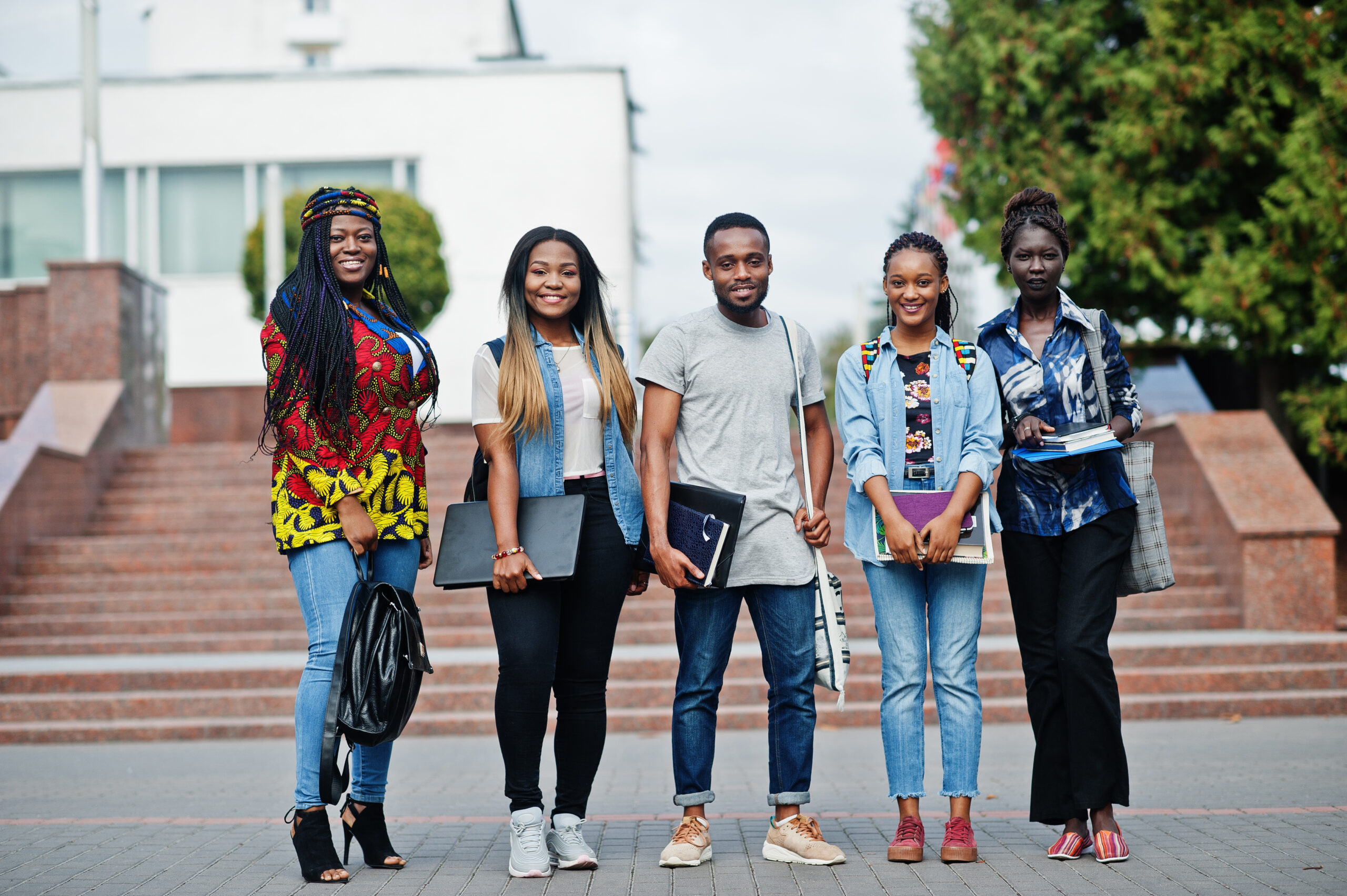 group of five african college students spending time together on